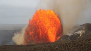 Huge lava fountain shooting up from the crater.